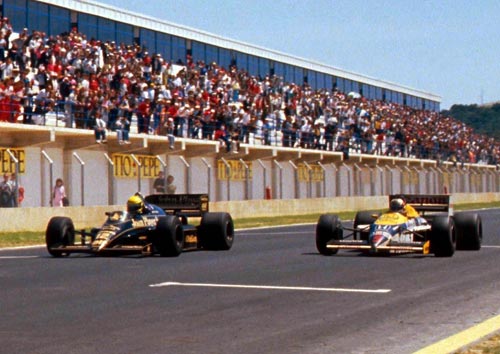 Race winner Ayrton Senna beats Nigel Mansell by 0.014s in the second closest finish of all time