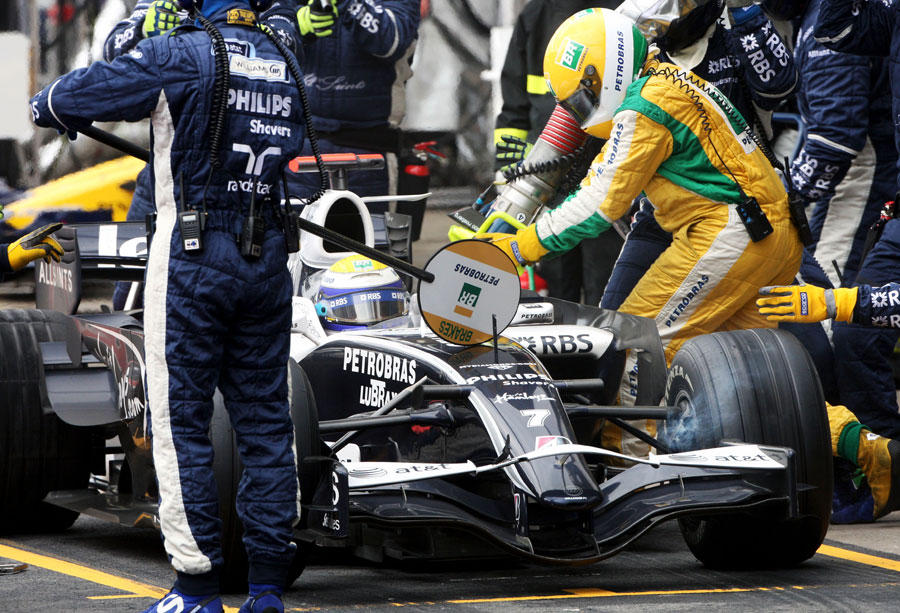 The fuel goes in as Nico Rosberg waits to be released from the pits