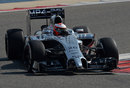 Kevin Magnussen clips the apex in the McLaren MP4-29