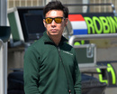 Kamui Kobayashi looks on in the pit lane