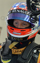 Romain Grosjean waits to get back into the Lotus