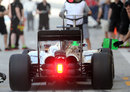A rear view of Kevin Magnussen's McLaren as he waits for the all-clear to leave the pits