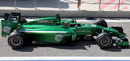 A side view of the Caterham as Kamui Kobayashi leaves the pit lane