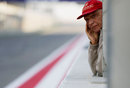 Niki Lauda watches on from the pit wall