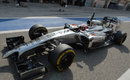 Kevin Magnussen drives his McLaren down the pit lane