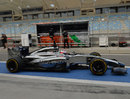 Jenson Button leaves the pits on Friday morning 