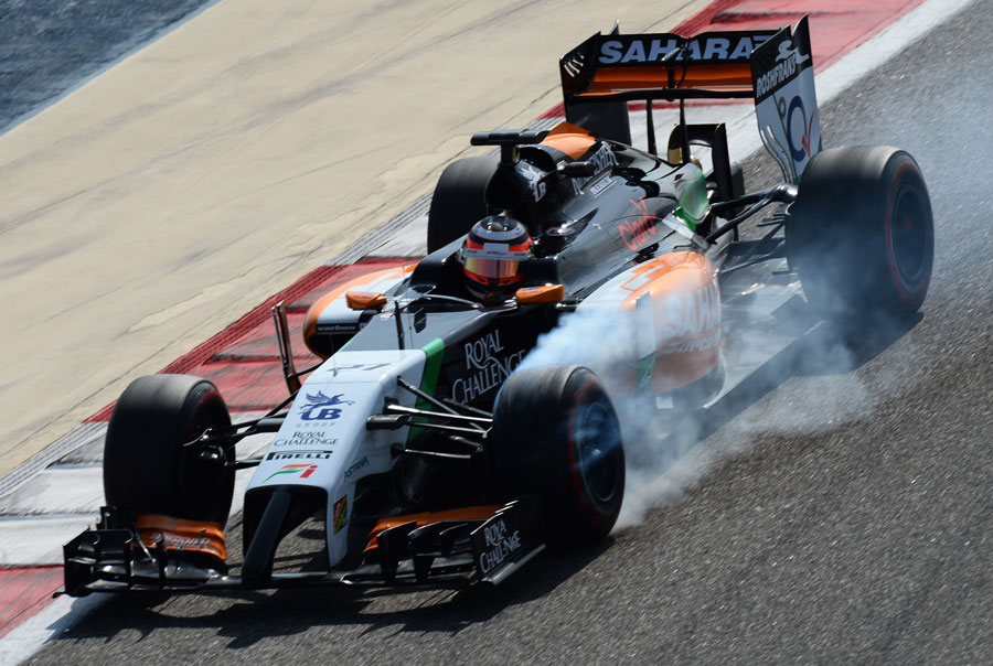 Nico Hulkenberg locks up the front left on his Force India