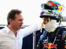 Christian Horner talks to Sebastian Vettel after he exits the RB10