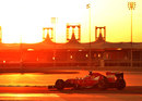 Fernando Alonso on track as the sun sets