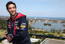 Daniel Ricciardo relaxes on a roof-top terrace overlooking the Albert Park racing circuit