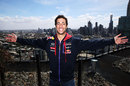Daniel Ricciardo poses for a photo on a roof-top terrace overlooking Melbourne