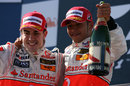 Fernando Alonso and Lewis Hamilton celebrate second and third on the podium