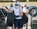 A Williams mechanic gets ready to practice a pit stop