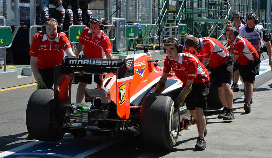 Max Chilton is wheeled back to the garage after failing to make it down the pit lane in FP1