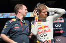 Christian Horner and Sebastian Vettel gaze down the pit lane