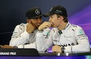 Lewis Hamilton and Nico Rosberg talk during the drivers' press conference