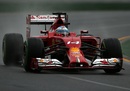 Fernando Alonso carefully drives his Ferrari in the tricky conditions