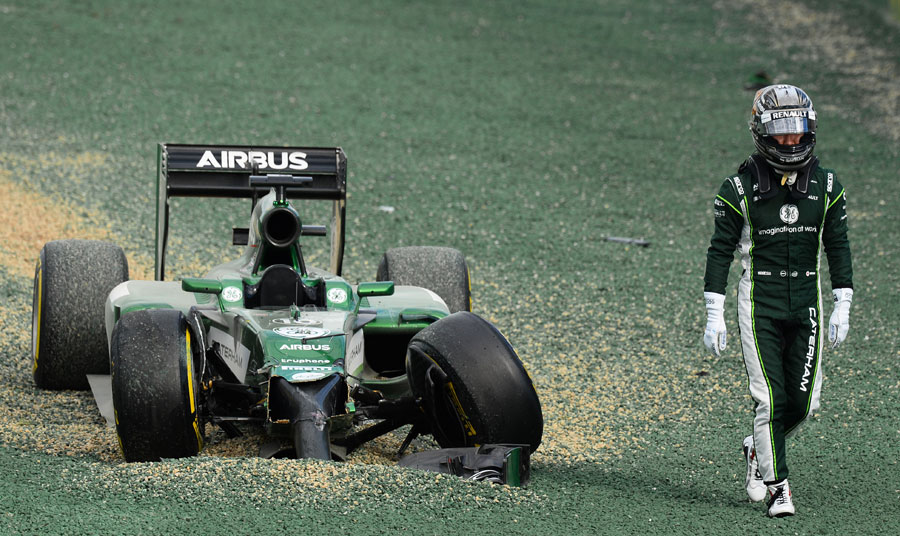 Kamui Kobayashi trudges away after his first-corner error