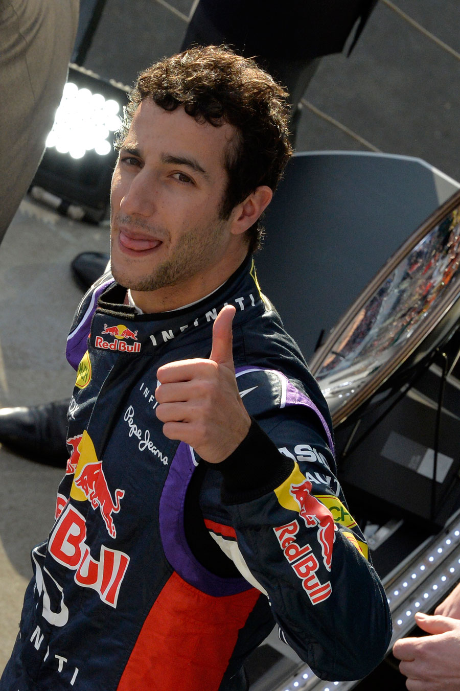 Thumbs up from Daniel Ricciardo as he leaves the podium