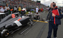 Adrian Newey checks out the Sauber of Adrian Sutil prior to the race