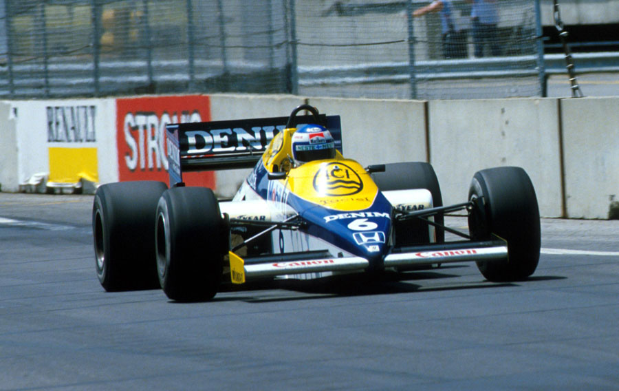 Keke Rosberg powers down the main straight on his way to victory
