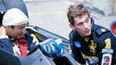 Elio de Angelis and Lotus team-mate Ayrton Senna in discussion on the grid