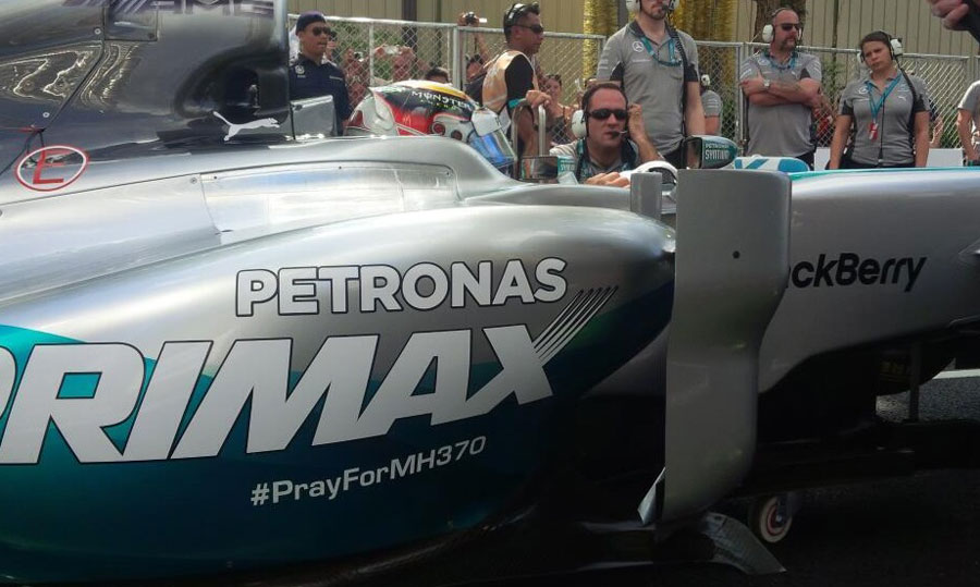 Lewis Hamilton's Mercedes displays a special message for the passengers of missing flight MH370 at a Petronas event in Malaysia