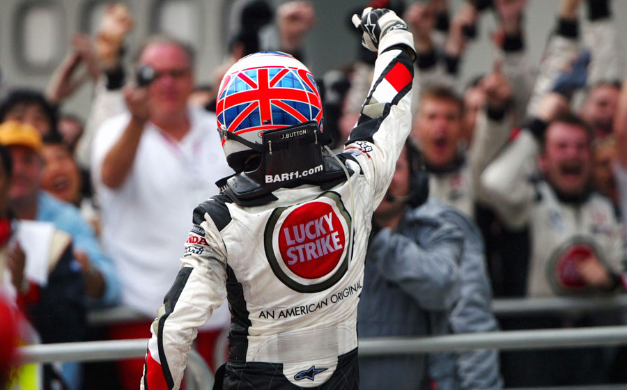 Jenson Button celebrates his maiden podium