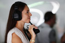 Jenson Button's fiancée  Jessica Michibata watches on in the paddock