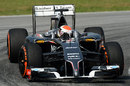 Adrian Sutil rounds the apex in the Sauber
