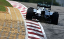Nico Rosberg uses the kerb on the exit of a corner