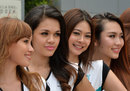 Grid girls pose for a photo in Sepang