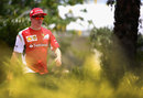 Kimi Raikkonen walks through the paddock on race day