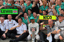 Lewis Hamilton celebrates his victory with his Mercedes team