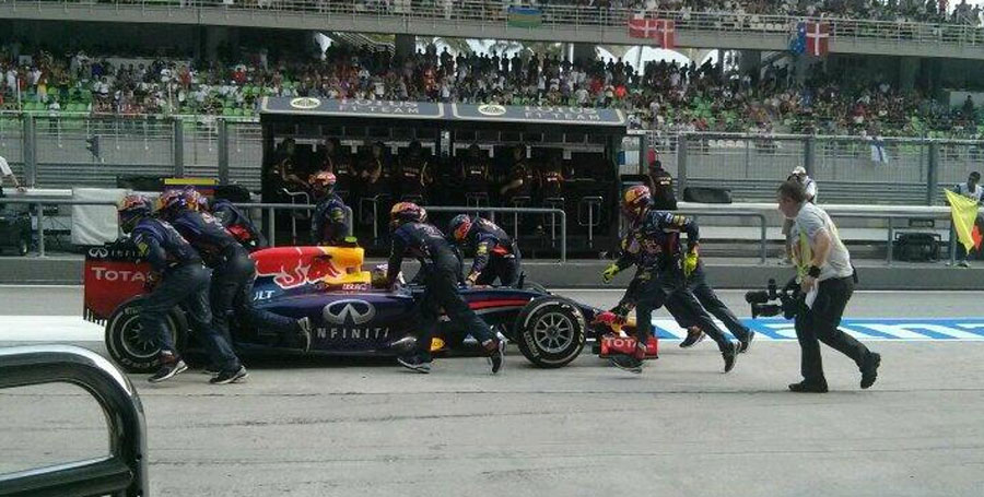 What a mess ... Daniel Ricciardo is pushed back to his pit after being released too early
