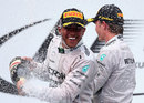 Lewis Hamilton celebreates his win on the podium