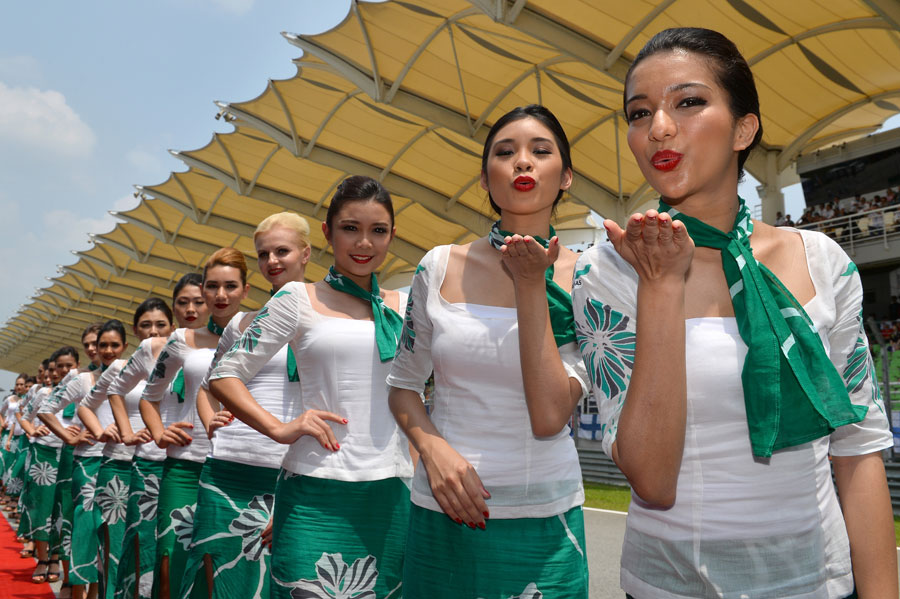 Grid girls pose for a photo before the race