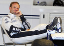 Rubens Barrichello relaxes in the Williams garage