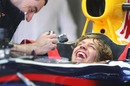 Sebastian Vettel shares a joke with his mechanic in the Albert Park pits
