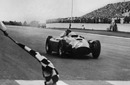 Juan Manuel Fangio crosses the line to win the Argentinean Grand Prix