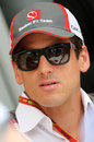 Adrian Sutil talks to the media in the paddock