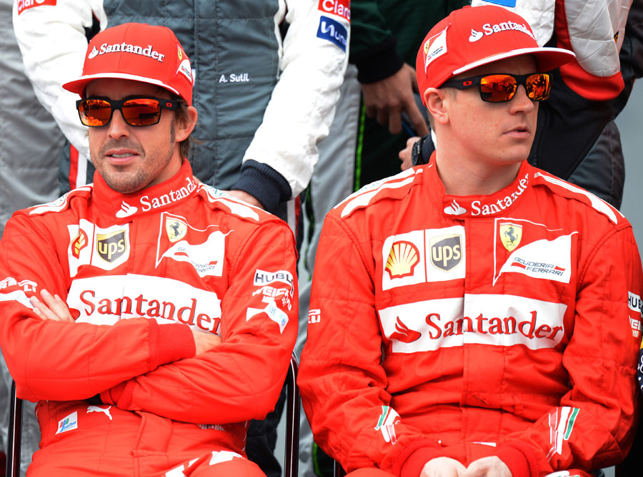Fernando Alonso and Kimi Raikkonen pose for the pre-season photo
