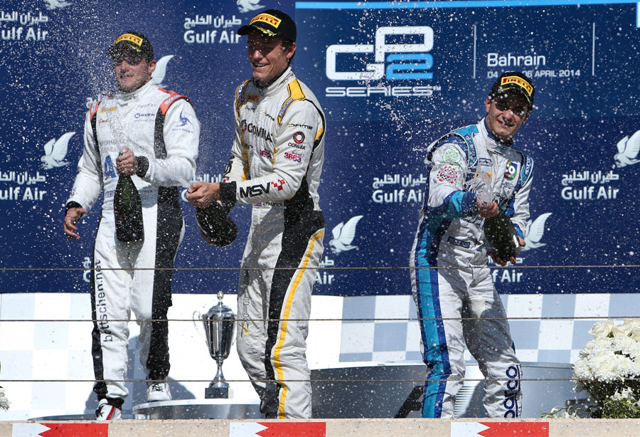Jolyon Palmer celebrates victory on the podium