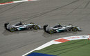 Nico Rosberg has a go down the inside of Lewis Hamilton