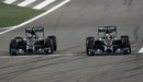 Nico Rosberg goes for a pass on Lewis Hamilton at Turn 1