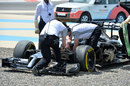 McLaren inspect Kevin Magnussen's McLaren after he ended up in the gravel
