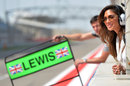 Nicole Scherzinger watches Lewis Hamiton complete another lap during testing