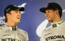 Nico Rosberg and Lewis Hamilton confer on the podium