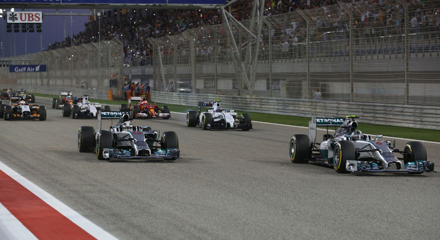 Nico Rosberg and Lewis Hamilton lead the cars away from the grid