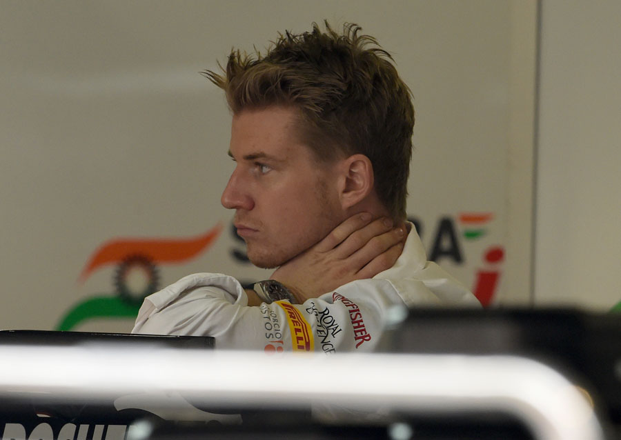 Nico Hulkenberg watches on in the Force India garage on Thursday